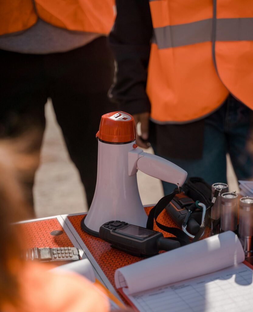 Focus on teamwork and safety with visible protective gear and communication tools.